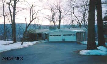 Custom built stone ranch, private yet close to town, beautiful view. Great view from most rooms, excellent condition, one owner.