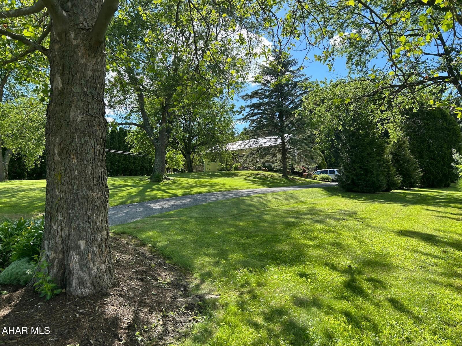 Great Raised Ranch (4 BR, 2 Bath, 1 Car Garage) in a Private Spot on the Outskirts of Bedford! Beautiful Views of the Mountain!  This Comfortable Home has 2 Bedrooms and 1 Full Bath on the Main Level and an Additional 2 Bedrooms and 1 Full Bath on the Lower Level (with Ground Level Walkout). Open Concept includes Kitchen, Dining Room, and Living Room with Vaulted Ceiling and Natural Light. Laundry on the Lower Level (Could Easily be Returned to Its Previous Spot on the Main Floor). Beautiful 0.716 Acre lot Gives Plenty of Room to Entertain and Garden. Sip Tea on the Large Deck while Enjoying the Wonders of Nature. Features Metal Roof Installed in 2020.; an Integral 1 Car Garage, Storage Shed; and Private Drive, Very Close to the Major Roads and all the Amenities of Bedford. The Location and Views must be Seen to be Appreciated!