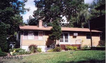 Secluded location in a lovely neighborhood.  3BR's, one could be sunroom with lots of windows and fireplace. Secluded location in a lovely neighborhood.  3BR's, one could be sunroom with lots of windows (1 large bow window), 1st floor laundry, fireplace, nice brick patio, many nice trees and shrubs, 1 screened in porch and 2 decks.