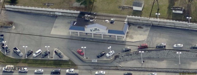 Former/Current Automobile Dealership on 1.4 Acres. The building is located on a corner lot in a high traffic area. The building has 3200 SQ. FT.and 18 FT. Ceilings. Close to local eating and Shopping.