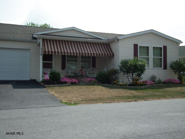 Immediate occupancy! Upgraded home offers granite counters in Kitchen & Bath, Customized window treatments, secuity system, canned lighting w/ dimmers, cherry stain cabinets, lg. laundry/mud room-2 bedrooms-2 baths, Landscaping edging, Paved patio-awning. Enjoy this gated community home ownership w/o the outside maintenance.