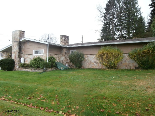 Stone rancher with 3-BR, 1.5 BA. Fireplace.