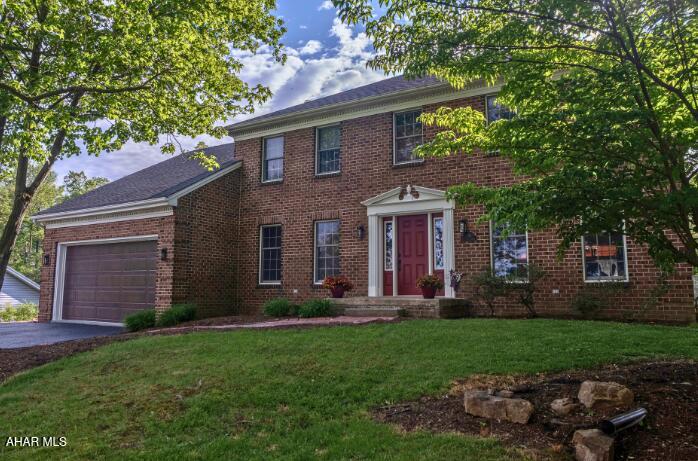 Nestled in the sought-after Elmwood neighborhood of Hollidaysburg, this timeless brick two-story blends elegance, comfort, and exceptional space. Offering over 3,100 square feet of finished living space, this 4-bedroom residence features a stunning oversized ensuite complete with a versatile bonus room ideal for a private office, dressing room, or flex space. Hardwood flooring welcomes you through the foyer, while the spacious layout offers both formal and casual living areas designed for entertaining and everyday comfort. Enjoy the convenience of first-floor laundry, a dedicated main-level office, walk-in closets, and an attached 2-car garage. Outdoors, unwind on the screened patio, or enjoy the expansive deck with lounging and seating areas. All located just minutes from shopping, dining, and everyday conveniences in one of Hollidaysburg's most desirable locations.