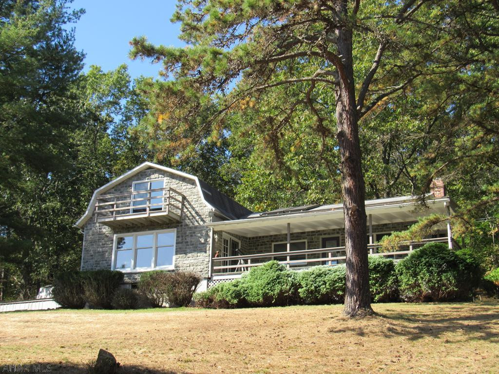 Home with a million dollar view & low cost of living? YES! Enjoy the stunning view of morning mist while sipping coffee on the 2nd Flr balcony off the master BR.Enjoy the impressive view watching turkey & deer while sipping wine on the sweeping front porch or from the broadbank of living room windows.This home is ready for you to move right in. A 2-story pole barn plus 2 more out-buildings will store all of your equipment,toys & provide ample room for workshops & hobbies.Hike or ATV the trails through the 23 acres to adjoining state game land.Ideal for hunting.This property consists of both forested & cleared land with a stream bordering one side The Clean & Green program lowers your taxes.Property borders Bald Eagle State Forest. A unique property like this does not come along very often