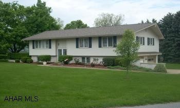 Great home on large flat corner lot.  Newer kitchen, sunroom, roof and siding.  Nice finished lower level with game and TV area.  Mud room for extra storage. Budget electric for heat, lights, hotwater, cooking, dryer, is $243/mo.  Move in condition and room for a pool too.  Call John 329-1856.
