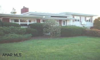 One of a kind home designed and built by an architect - remodeled to total perfection!  Top of the line upgrades in kitchen and bath, master suite, 3 Season Rm w/built in gas grill, 2 family rooms (one for you, one for the kids), 2 FP's,  excercise rm and so much more!   Quality commercial grade  roof.   Great home for entertaining.    One of Hollidaysburg's finer neighborhoods.