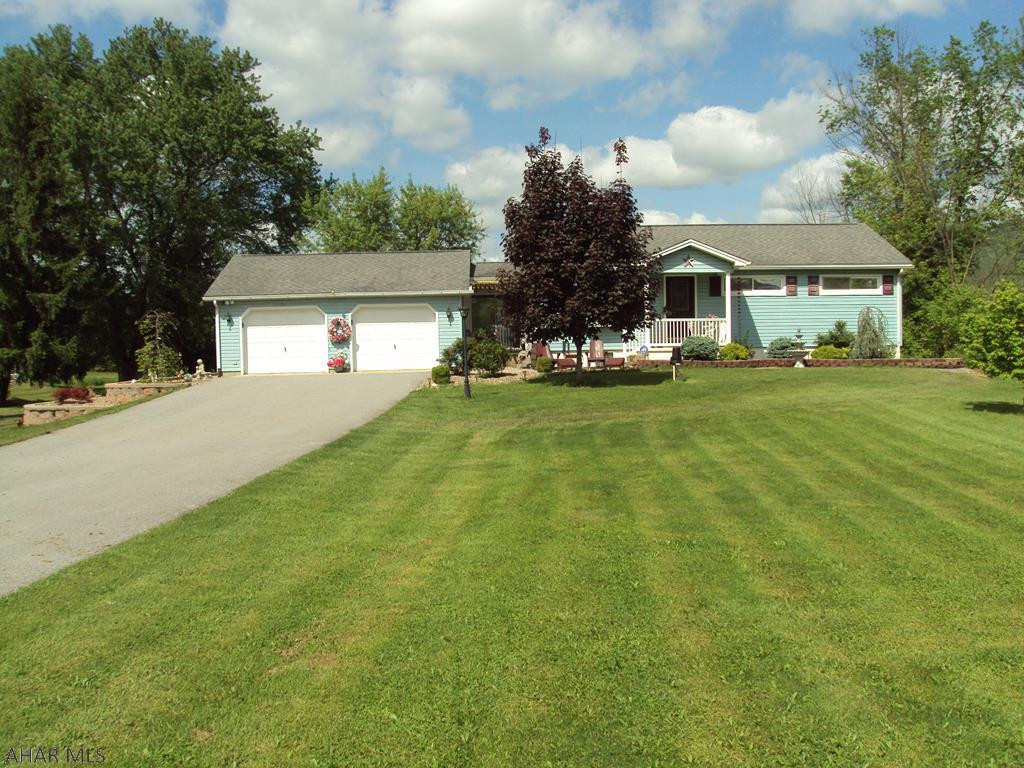 Nice Home!  Private Setting...Live out but very convenient!  4 Bedrooms and 2 Baths.  1 Bedroom and Bath in Basement.  Sunroom off of Master Bedroom.  Remodeled kitchen.  2 car garage.  2 acres.  Lots of out-buildings.  18'x'36'12' carport with 38' camper included.  Home not in flood plain.