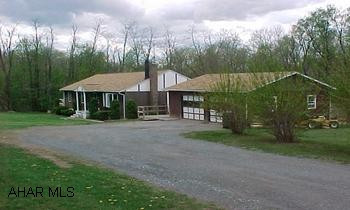 Private setting on 2.31 acres. Inground pool. 2 extra bedrooms in basement level. Needs TLC. Roof 4 yr old. Sold "AS IS".  Horseshoe pits with lighting. Call Dianne for Addendums.