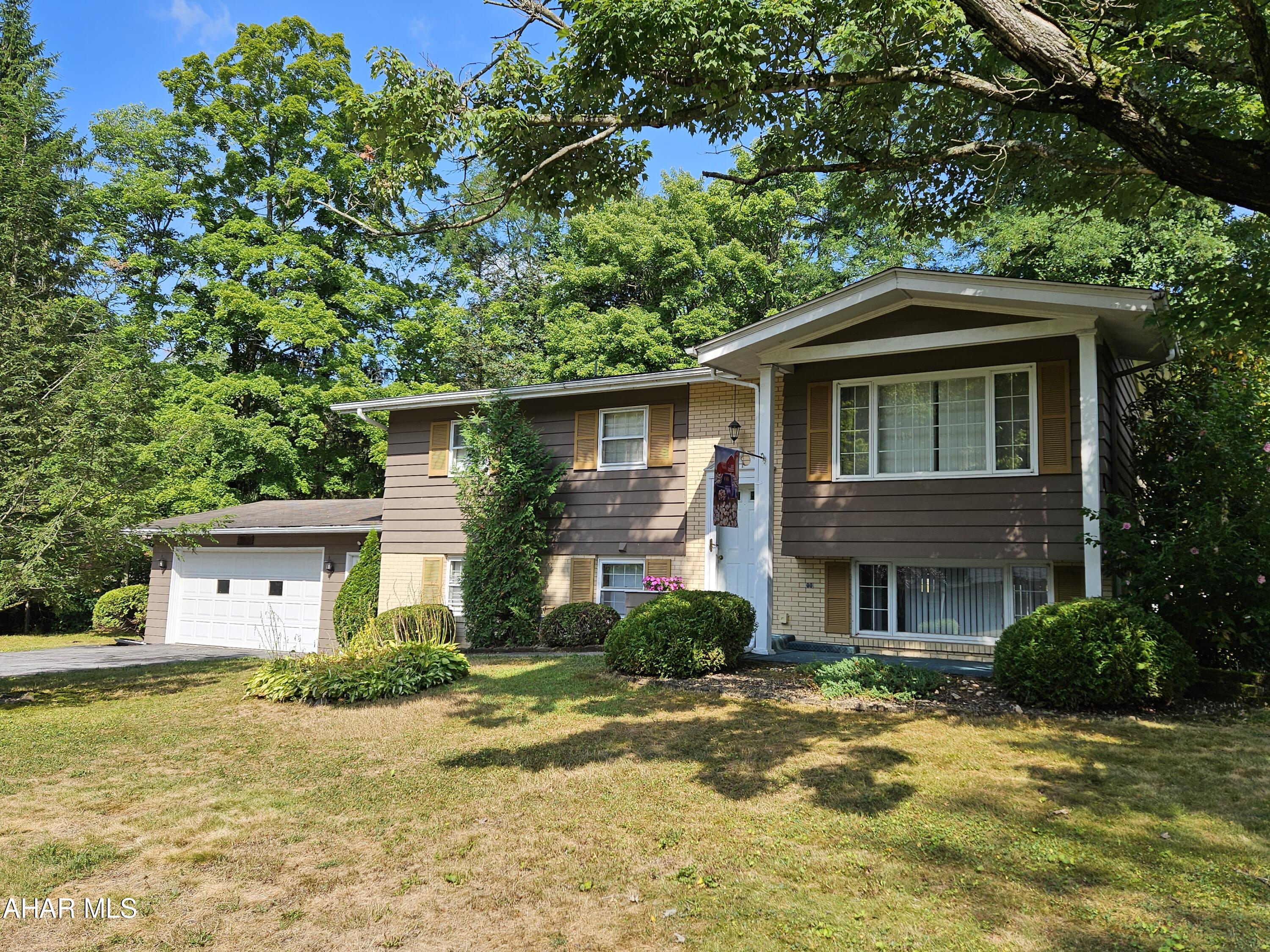 Tipton bilevel with a beautiful, private lot.  Cul-de-sac with a small creek for peaceful sounds.  2 large bedrooms on the main floor and 2 possible bedrooms in the lower level.  Each floor has a full bath and the lower level has a large family room with wet bar and walk out to a nice patio.
