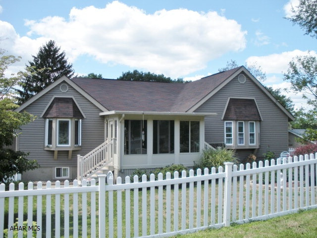 Awesome 3-4 bedroom home located on a corner lot close to Altoona Campus. This home has many updates, newer roof, windows, & vinyl siding. 3 season room, kitchen w/fireplace, formal dining room, large living room, master bedroom w/full bath, lower level family room w/wet bar, laundry, & half bath. Plus this home includes an amazing in-law suite with oak eat-in kitchen, dining room, living room, bedroom, & full bath. This is a must see home!