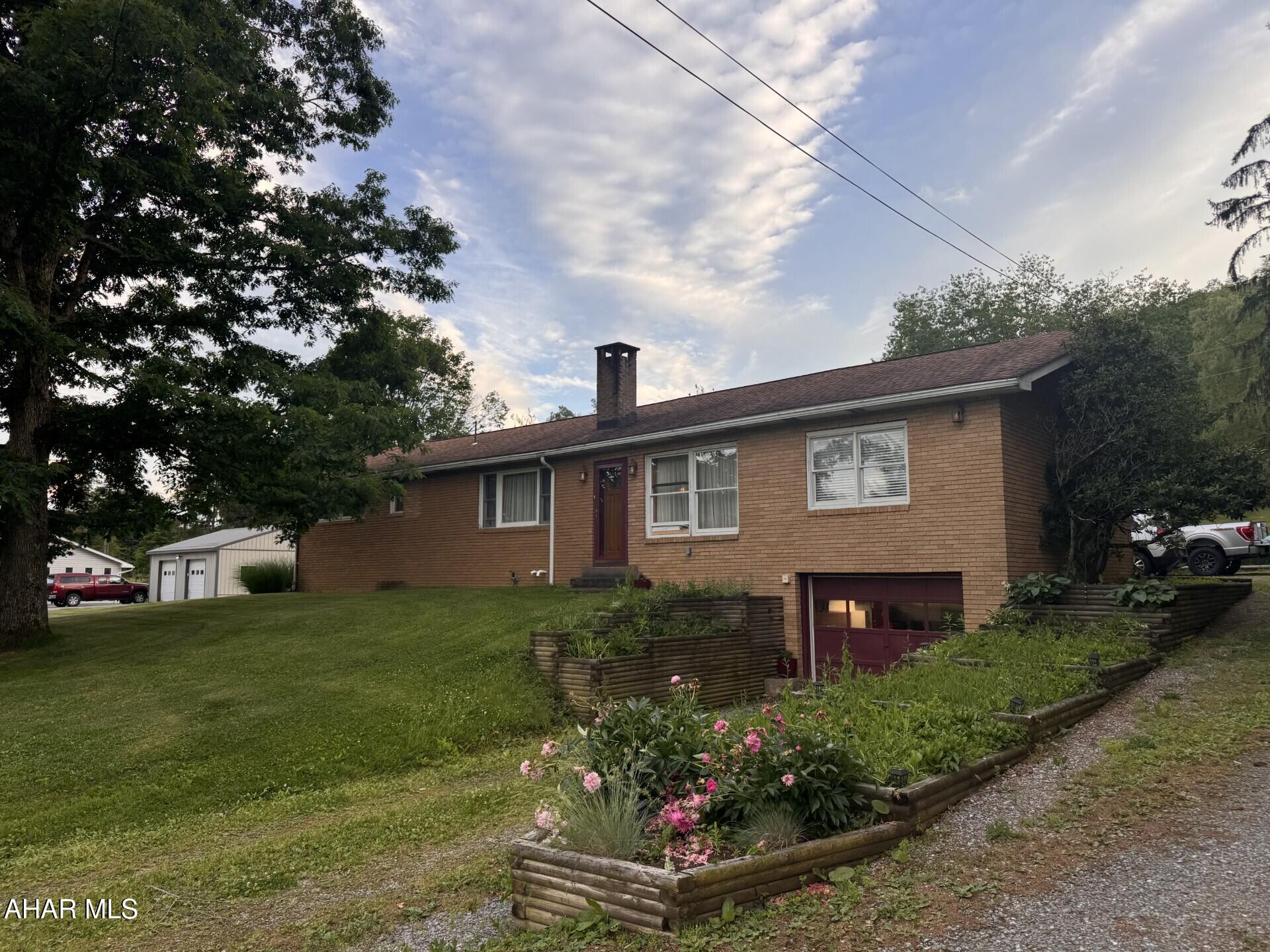 Very rare to find a  3 bedroom 2 bath home with 2+ acres, a great yard with views and also be totally remodeled.  Spacious kitchen with bar for additional preparation area.  Breakfast nook.  First floor laundry.  New gas furnace & newer roof.  Hardwood trim & doors thru out.  Enclosed rear porch to relax & enjoy the wildlife.  Multiple flower beds, grape arbor, & outbuilding for your tools.  1 Car integral garage.  All appliances included.  Basement could be additional living space as owner had trains set up year round.  Lots of storage space.  Ready to move in.