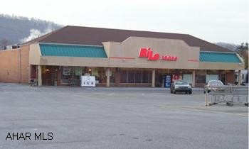 14,100 sq ft grocery store on 1.24 acres in Hollidaysburg Borough with paved parking for 100 vehicles. Leased to Bi-Lo with 3 1/2 years left  on initial term with four 5 year option to renew. Triple net lease with annual net income of $82,215. Zoned residential with approved non-conforming use. Tenant responsible for taxes, insurance, and CAM.