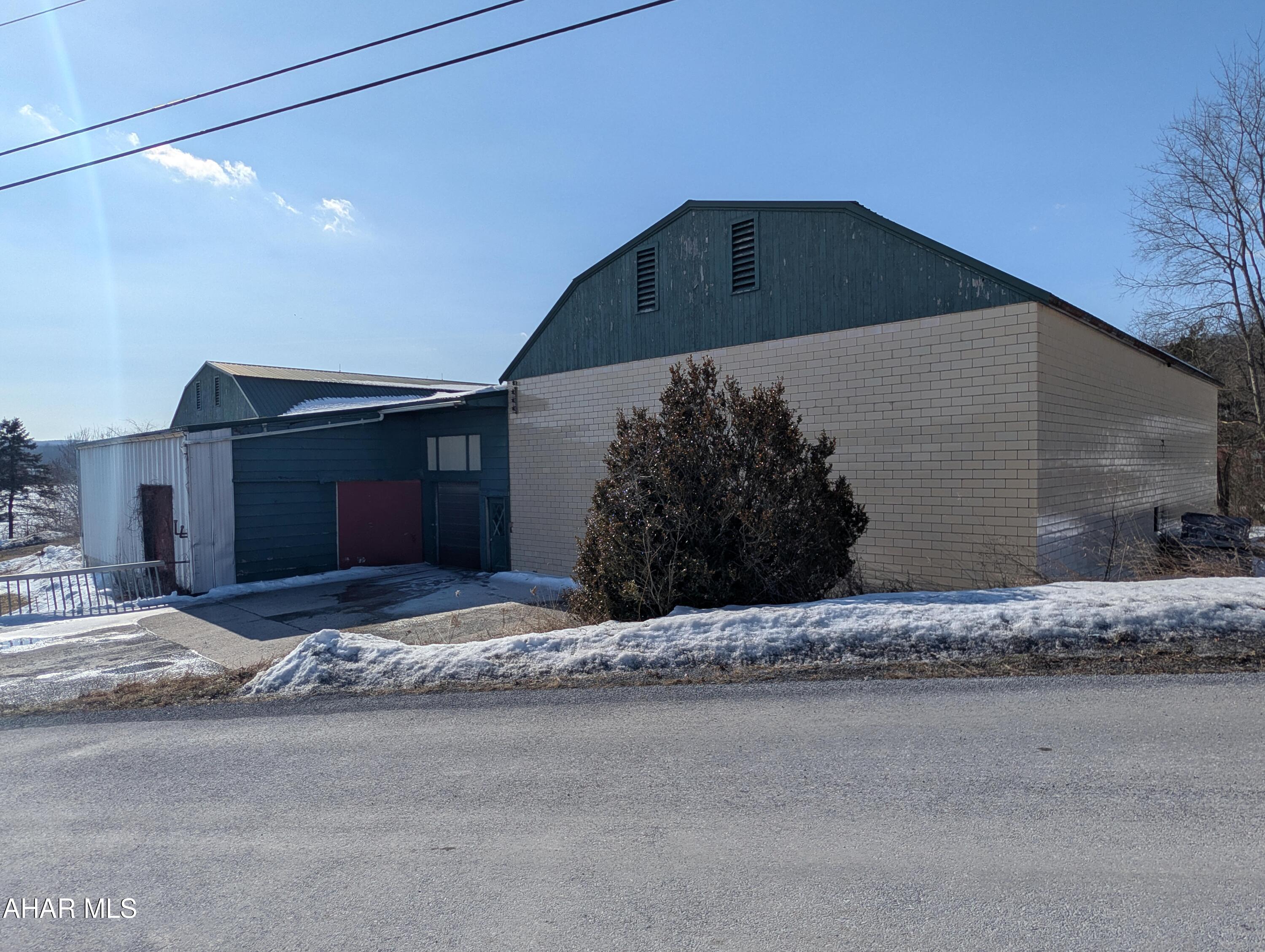 Explore your next investment opportunity in the rural Bedford County. PA. Spanning across 1.927 acres, this property offers a world of potential for visionary buyers eager to craft their growing business. 

The defining feature is a versatile storage building equipped with refrigeration, providing ample space for creative endeavors, additional storage, or business pursuits.  This property used to be used for orchard storage and makes a great opportunity for someone wanting to expand their dream. While the building awaits revitalization, its framework provides a strong foundation for endless possibilities.

The generous parking enhances convenience and easy access to an overhead door and loading dock.  If you're an investor or a growing business owner looking to capitalize on growth potential and with dreams of customizing each corner to suit your vision, this property beckons with promise.  Schedule your showing today!