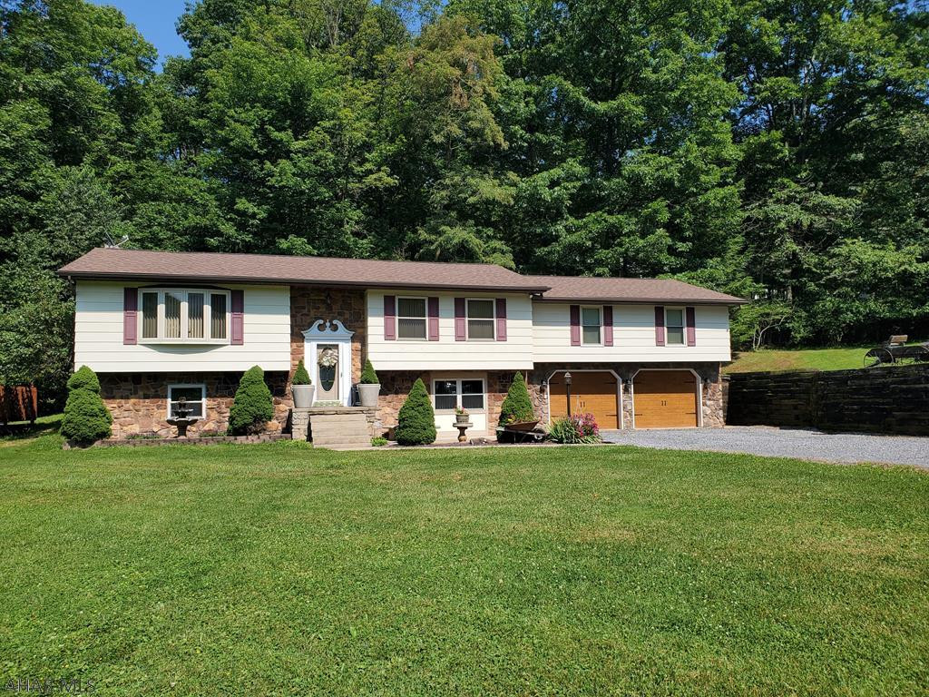Exceptional bilevel style home in Riggles Gap area with 52x52 - (5)bay garage with attic space above..   in addition to a 2 car attached garage with workshop and large storage shed!. Bellwood-Antis School District on over 1.5 acres. 3 bedrooms with lots of storage and closet space, 2 baths with nicely remodeled kitchen w/tray ceiling and maple cabinets, workshop, finished family room, covered porch, above ground pool, central air.  Perfect location between the Altoona and Bellwood! Kitchen has farm sink. If needed, 1st level could be an apartment. Home surrounded by the beautiful mountains of Central PA that you can enjoy from the spacious trex deck!  119 Graham Drive is included in the sale and has well & septic the (GARAGE is on that parcel).