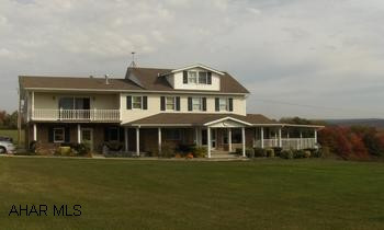 All showings must have Louann Hoffman or Cathy Tubo present. All showings through Louann only.  Pre-approval letter prior to all showings. NO EXCEPTIONS.  Please, no showings prior to 24-48 hour notice.Country estate, Fabulous Views from every room in the house!  Exceptional Master Bedroom suite with full bath with whirlpool.  MB has gas fireplace with French doors to 2nd floor balcony.  MB and bath also has radiant heat in floor.  Covered deck overlooking pond.  Formal DR, large laundry room with full bath.  Fenced area for dogs.  Full partially finished basment.