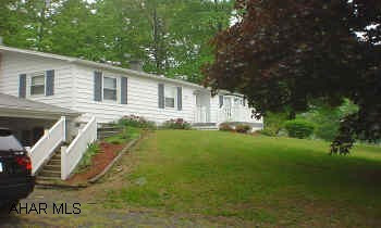 Two 275 gallon oil tanks, septic and well tested November 2004, UV light replaced April 2005, and new roof June 2005. Home is stick built frame and vinyl.  Great ranch home on 1.5 acres. Many updates, new roof, new 200 amp. service, and new 100 amp. service to garage. Beautiful custom oak kitchen, central air, wooded lot with tree house and fire ring.