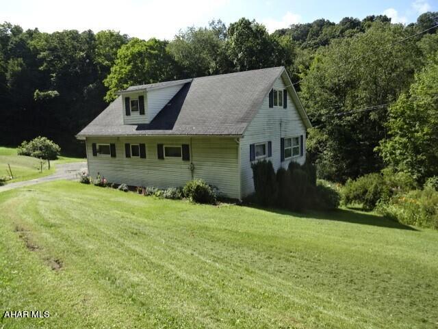 Private! This house is tucked away among the trees & woodland. Fruit trees & berry bushes. 2 heating systems- Oil Furnace & coal furnace (coal bin is approx 2/3 filled as of listing date) Radiator heat throughout. 2 car + garage, plenty of room for mowers and ATVs. Located at the end of the street. Great privacy!