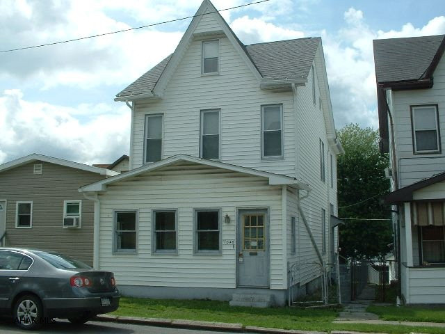 Good solid starter, newer roof, siding, and most windows.  Fenced yard, large rooms.
