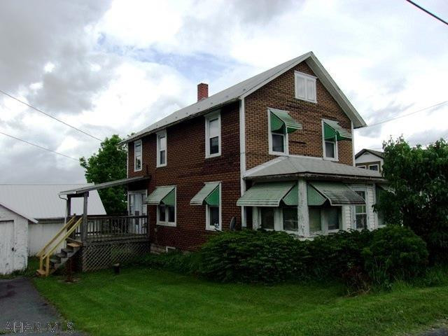 This 4 bdrm, 1 bath home has much potential. Lots of space, original woodwork & some built-ins. Nice sized yard w / room for a garden. Enormous garage / barn has 2 rooms & a loft. Space for a workshop tp work on cars. Needs some TLC, but could be great storage for all your "toys".