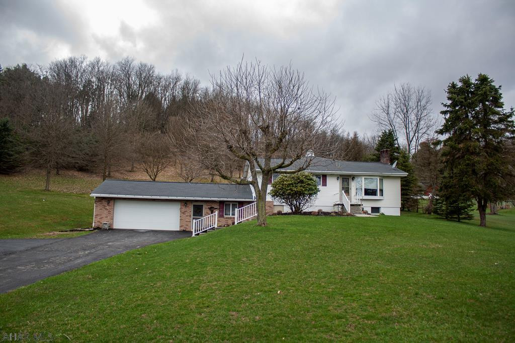 This updated ranch style home has it all!  The large (over 3 acre) lot is just the start.  The home has 3 bedrooms and 2 full baths.  The downstairs full bath has been updated and features a walk in shower with multiple shower heads and ceramic tile throughout!   There is an eat-in kitchen with included stainless steel appliances.  Off the one side of the kitchen you will find the living room which has a large window to allow for natural light and a mini-split unit.  Off the other side of the kitchen there is a family room with gas fireplace and vaulted ceilings.  There is a full basement with plenty of storage space as well as a 2 car attached garage.  Virtual tour available on brokerage website and Realtor.com.