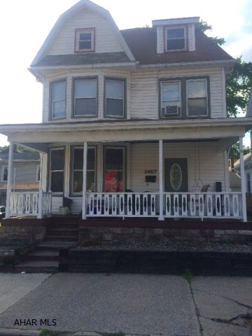Looking for Space? This home is for you! With 5-7 rooms/bedrooms(two of the rooms do not have a closet or heat but are used as a bedroom/office), 1.5 baths, separate laundry room you can grow into this home. You can have a office, work out room, play room however you decide to use the 7 rooms. Did I mention the back yard where you can enjoy a summer evening grilling with friends. Front porch to enjoy the warm evenings. Off street parking(Driveway)!!Zoned commercial if you have a business!!! Wood burner that will make the house warm in the winter!! The stunning hardwood floors makes this home more attractive. If you like the old hardwood around the doors, stairs you must see this house. Located in the Heart of Tyrone!!!!!
