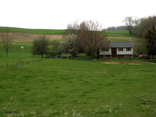Farmette on 10 beautiful acres. House has been remodeled - new cherry kitchen w/ granite and all appliances, new roof, new windows, new siding, new doors, new carpet, new cherry bathroom w/ granite and whirlpool tub, new heat pump. Includes newer 48x60 barn w/ electricity, 30x50 barn w/ electricity, 12x18 workshop w/ electricity and A/C. Kennel w/ cemented run, chicken coop and 10x28 loafing shed.  Ideal for cattle, sheep or horses. Eight acres w/ 6 wire high tensile fence and pasture division fences w/ 3 wire high tensile fence. Two wooded acres. Great country and mountain views!!