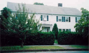 2-Story Traditional home in Everett, 4 car garage, 3 car carport, tennis court, large yard.Master bedroom has full bath and fireplace.  Beautiful front staircase, crystal chandlier in foyer. This is a must see home! Lots of space, extra features. Also two apartments on property to use for extra income. Home has security system.