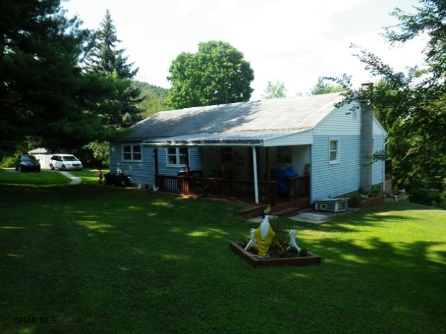 Country location! 3 BR ranch on almost an acre. Newer kitchen, enormous living room. Oil HW heat, shed, 2 decks