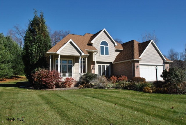 This 4 bedroom home is ready for your family.  Sitting on 1.6 acres, & features such special items as an efficient geo-thermal system to help keep those utility bills to a minimum, a whole house generator in the event that power should go out, and a wonderful glass enclosed 4-season porch.  If that's not enough, how about a new (upscale) kitchen with new LG appliances & new hardwood flooring.  A vaulted ceiling in the living room with floor to ceiling windows to bring in the outdoors & a gas fireplace for those cool evenings.  Entertaining, the lower level is finished with new carpeting & paint and has a half bath that is plumbed for a shower.  The upper level boasts of 3 additional bedrooms and a spacious studio/guest room & to top it all off, how about an oversized two car garage.