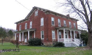Charming 2-Story brick home build in 1861. High ceilings, 4BR, sitting room, eat-in kitchen, den, living room, formal dining room. Pine plank floors covered with carpet. Has wood/coal furnace.