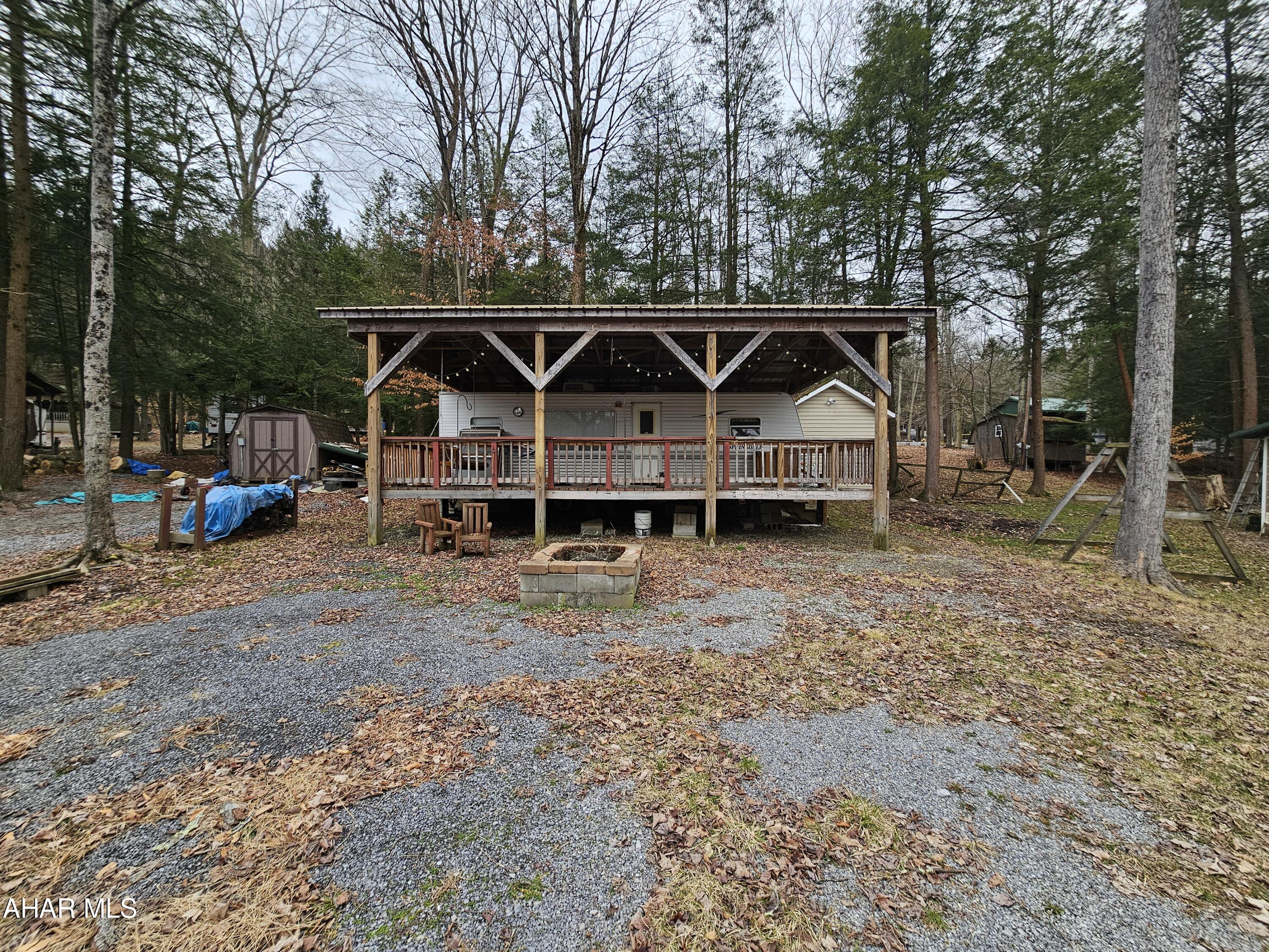 2006 30' camper on 1 lot inside Glendale Yearound. Camper has a large deck attached to it and a pavilion over camper and deck. Everything works in camper. Camper is clean and in good condition. Campsite is only a few minutes walk from small fishing pond. Shed included also.