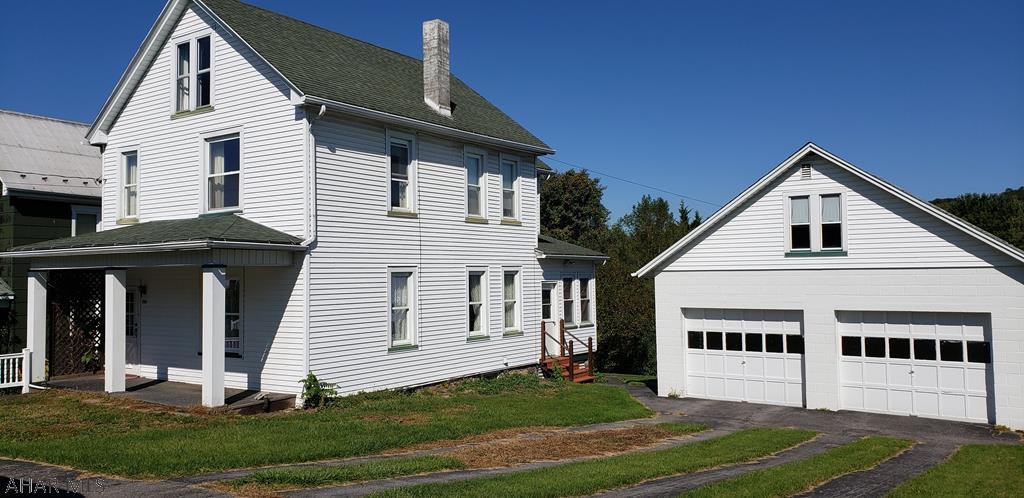 2 story home in a lovely neighborhood in Williamsburg. Property offers a garage with loft on 2 lots and additional buildings.  Oil heat with central air.  Replacement windows throughout.