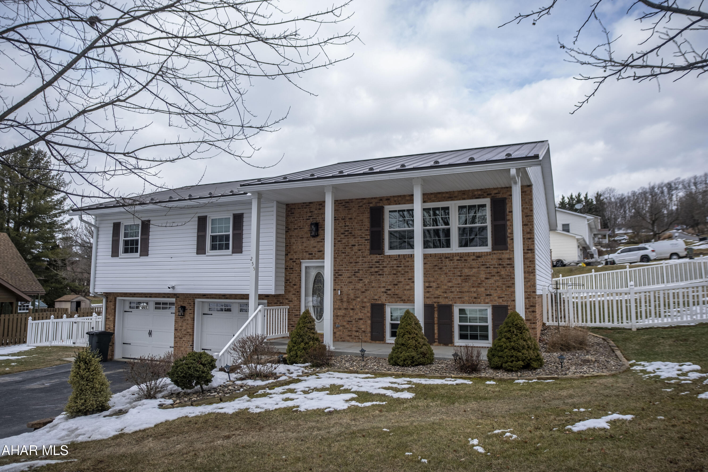 This beautifully maintained brick and vinyl home located in Rolling Hills offers comfortable living and fantastic outdoor space.. The well-designed layout features 3 bedrooms and 2.5 bathrooms.  The main level includes a nicely laid out and updated  kitchen, dining area and spacious living room which  are perfect for gatherings.  Also  a full bathroom, a master bedroom with an ensuite master bath with  two additional bedrooms. Downstairs, a large family room provides a relaxing space, along with a bonus room with a closet that could easily serve as a fourth bedroom, a convenient half bath, and a laundry room.  A desirable integral 2-car garage offers protection from the elements and includes an extra storage room for added convenience. Outside, is a meticulously landscaped, fenced yard .. The large back deck, complete with a built-in fire pit, is ideal for entertaining friends and family or simply enjoying quiet evenings. This  home truly has it all! Schedule a tour !