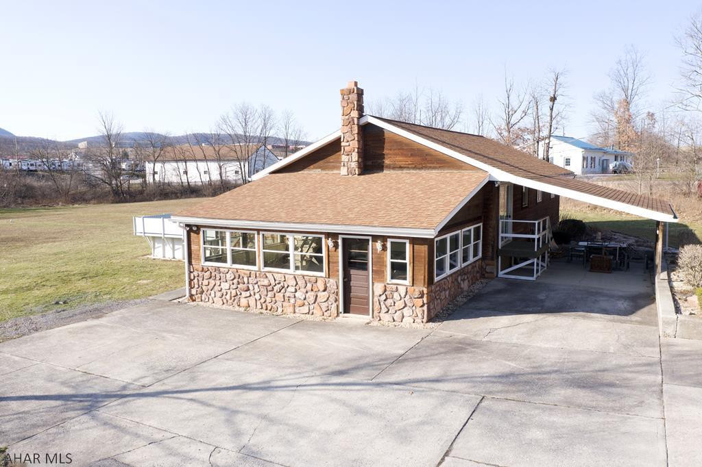 Beautifully maintained home in the Hollidaysburg School District! Enjoy 1 story living on approx 1.77 acres that is conveniently located near the town of Duncansville and PA-764. This home features 3 beds 1 full bath and an above-ground pool with access from the living room. There is also a second living room/sunroom with a wood-burning stove that can be used year-round. The two-story detached garage has two bays on the first level and plenty of room for storage on the second level. Located at the end of the street, you will not be bothered with thru traffic! With few updates, you can make this home yours!