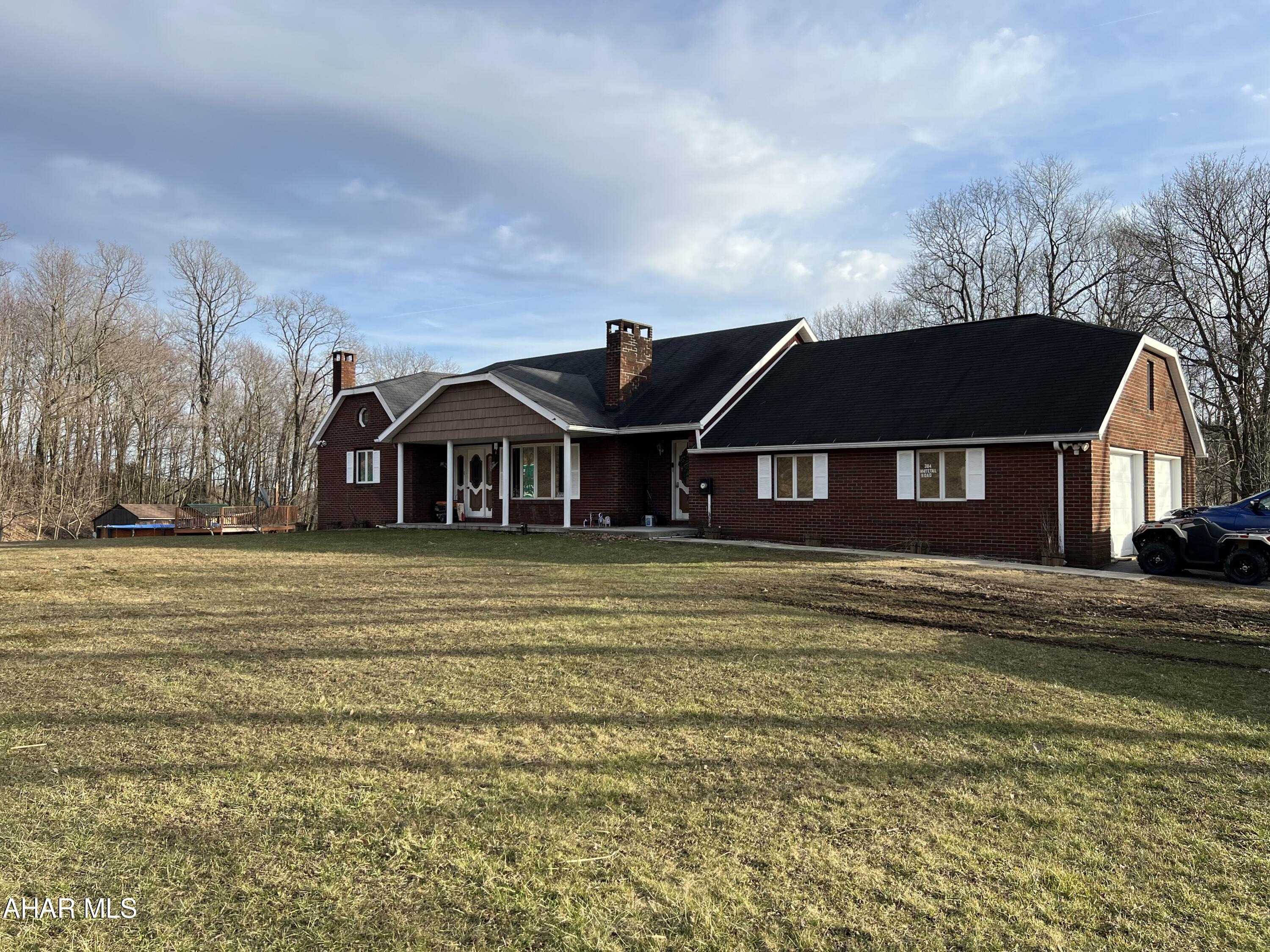 Chickaree Mountain MUST SEE! 5 bedrooms with 3 bath brick home. The main floor features a laundry/mudroom, and 2 bedrooms with bathroom featuring a double sink. A large kitchen opens to the dining room with a breakfast bar. There you have a sliding glass door for natural light, that leads out to a full length covered deck for you to relax in the mountain air. Upstairs you will find 3 bedrooms and 1 bath. Down from the main floor, a full finished basement with bar, a family room with a brick fireplace, and another bath. Central A/C & Central Vac. Above ground pool. Central Cambria school district. Property also features nearly 4 acres of land! Don't miss this one!
Address formerly known as 1809 Admiral Peary Highway.