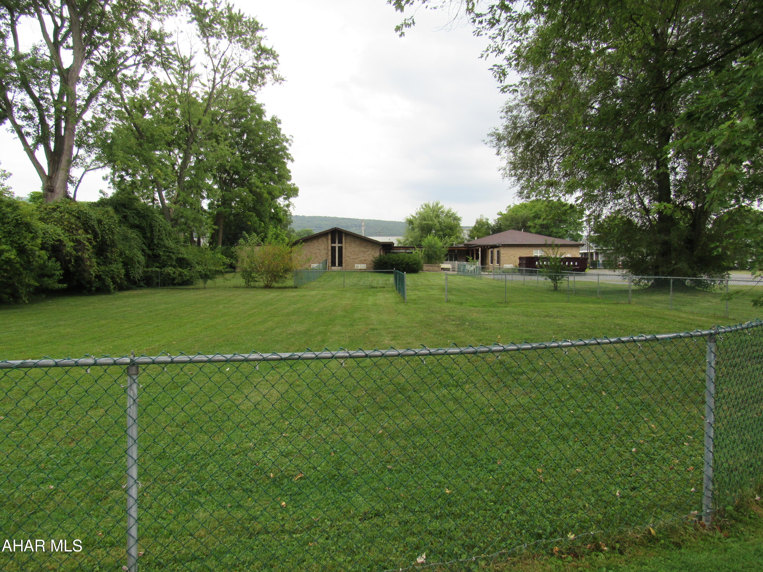 Located behind the new Reliance Building on Plank Road.  Brick one story on large fenced lot.  Multiple use.  Daycare, Office, School.  Many possibilities.