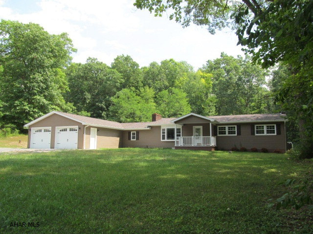 Completely renovated 4 BR, 3 bath ranch with over 2200 sqft of living space. You won't believe the size of the master suite that includes a large walk-in closet, spacious bath and sliders to the patio to enjoy your morning coffee. There's an additional 3 BR's and full bath, main floor laundry and another 1/2 bath. The kitchen includes a center island and is open to the living room that includes a wood burning fireplace. But that's not all...there's a 3400 sqft. building in the rear.  If you've been looking for a move-in ready home that's new inside and out with quality workmanship, look no further. Call today for your showing!