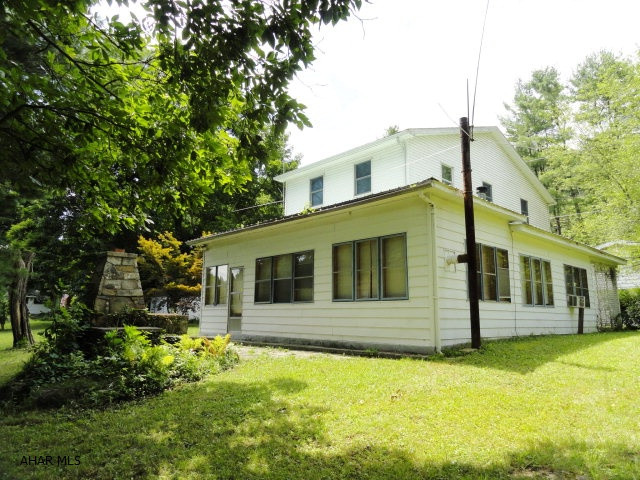 Unbelievable privacy and breathtaking river views. This one of a kind, river front cottage has walk out the door Juniata River fishing. Views must be seen to be appreciated. This 2 story cottage has a 1st floor BR plus a new 2nd floor loft area, could easily sleep 10 or more; loads of room!! 1st floor includes kitchen, living room, full bath w/shower and large enclosed summer porch w/wood burner.  Also boasts a new furnace, metal roof, 2 car garage w/storage, patio w/outside fireplace and a storage shed. Warriors Path State Park lies across the river - hiking, fishing, hunting, picnicking! THIS IS IT!!, the perfect family retreat. These river front cottages do not come along often, most stay in the family for generations...Start a new tradition today with this beautiful River Front Cottage