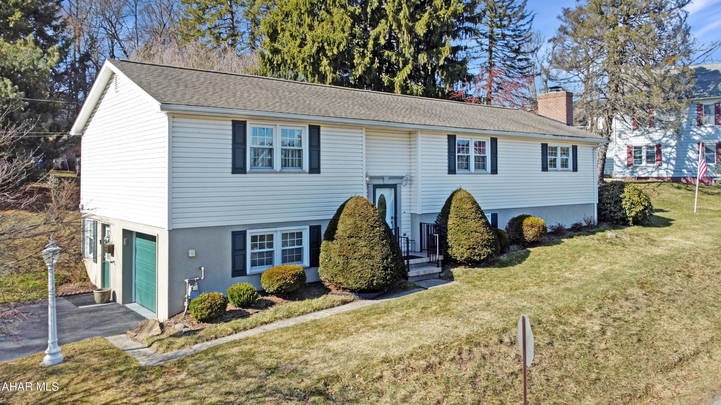 Welcome to 101 Tanner Street in the charming Ebensburg Borough, within the Central Cambria School District. This stunning split-level home is nestled on three parcels of land, offering approximately 0.7 acres of tranquil, private woods—a rare find in the borough. Conveniently located within walking distance of Lake Rowena, the dog park, the borough pool, & various amenities, this is truly an ideal location. Upon entering the main floor, you are greeted by elegant hardwood floors that flow seamlessly into the dining room & spacious living area. The first floor also boasts a generously sized updated eat-in kitchen that provides access to the rear deck, a cozy family room featuring a wood-burning fireplace, an updated three-quarter bath, & two expansive bedrooms accompanied by an additional full bathroom. The walkout basement enhances the home's appeal, featuring a third bedroom, an integral garage, & a mechanical room offering extra storage space. The exterior of this property is where it truly stands out, combining the luxury of private living w/ the convenience of being in town. Enjoy a large off-street parking area, a rear patio, shed, a spacious yard, a wooded area, & an additional lot along E Sample Street. This property has so much to offer—don't miss out! Call today to schedule a viewing!