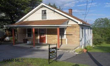 Ebensburg- 3 BR stone & vinyl sided Cape Cod on nice lot with great view! Remodeled kitchen  with wrap around deck & great view!.