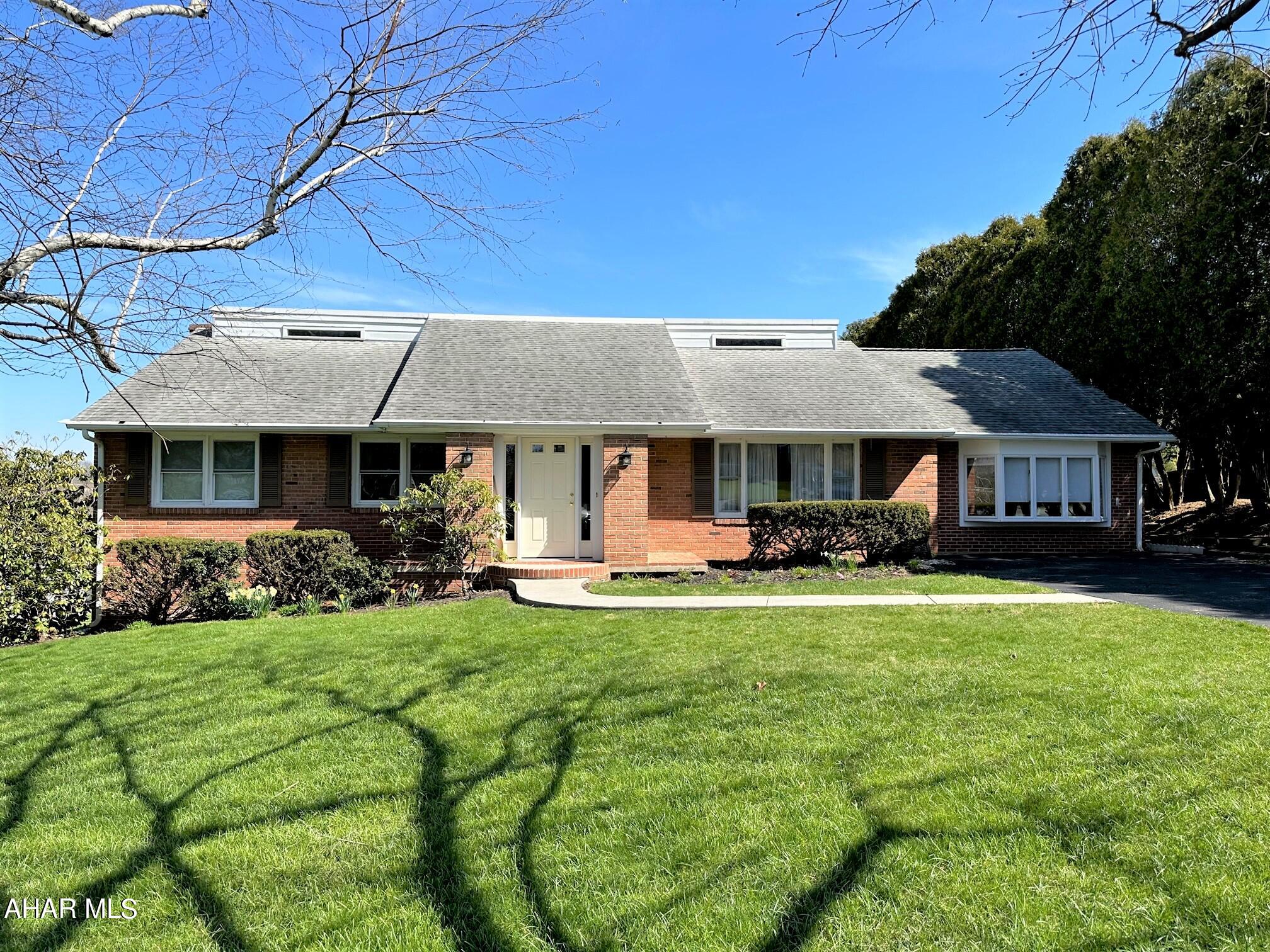 Beautiful brick home located in Meadowbrook Terrance Development!! This fantastic home offers a living room, kitchen, dining room, den/office, family room, sitting room, two bedroom and one and one half baths on the main level. Large enclosed porch off the kitchen for entertaining or enjoying those bbq's. Second level offers two bedrooms, a jack & jill bathroom with two half baths and a shower, and office. The lower basement has a large rec room with wood burning fireplace, laundry room, bonus room and another half bath. Heat pump with central air, insulated windows, hardwood floors, rear patio and much more. Terrific location close to all schools, the downtown area, the Heritage Trail, Bedford Elks Country Club, and the Omni Bedford Springs Resort.