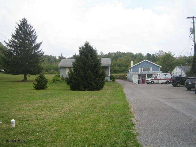 Prime 1+ acre Commercial Property on busy Plank Road. Centrally located and close to Walmart, Logan Valley Mall, Meadow's Intersection, Blair County Convention Center and I-99. No zoning, so possible uses only limited by your creative imagination. Currently single family ranch home plus separate concrete block commercial building with attached heated 2 car garage.