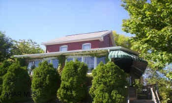 Enclosed ft. porch, 1st fl. 1/2 bth, corner lot, shaded lot. shed.  Off street parking in rear.