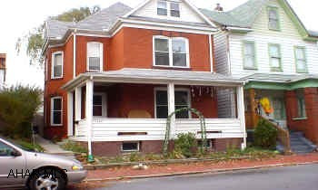 3 story brick, 4 bedrooms, new windows and roof, beautiful woodwork, high ceilings, large rooms.