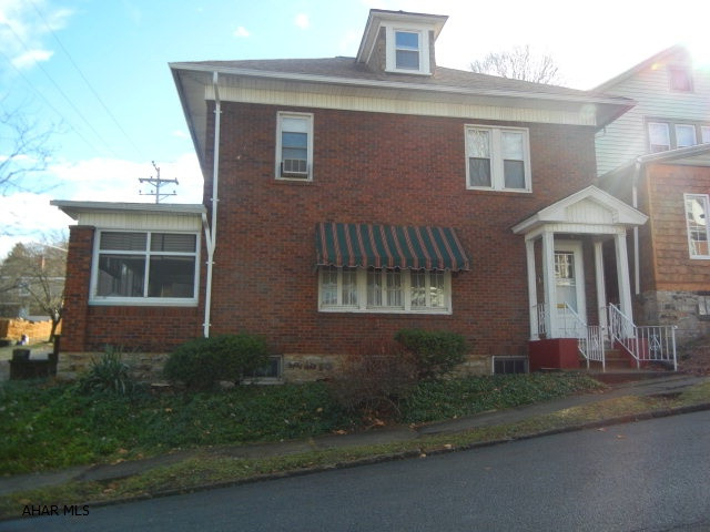 Corner brick home in Fairview.  Large living room, formal dining room, charming sunporch on side.  three bedrooms on second floor with additional room could be a den or office.  Finished third floor.  Lots of storage and all appliances included.
