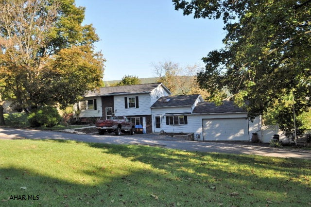 SPLIT ENTRY  THE PLEASANT VALLEY AREA. Features 3 BEDROOMS 2 BATHS UPDATED KITCHEN CORIAN COUNTERS CERAMIC TILE FLOORS LARGE FENCED IN YARD 2 CAR GARAGE, NEW WINDOWS LARGE DECK WITH COVERED AREA COOK OUTS WITHOUT WORRY ABOUT THE WEATHER INCLUDES SUNROOM 10x16 ON THE DECK GREAT GET AWAY. UTILITY BILL IN DOCUMENTS AGENT IS A LICENSE REALTOR