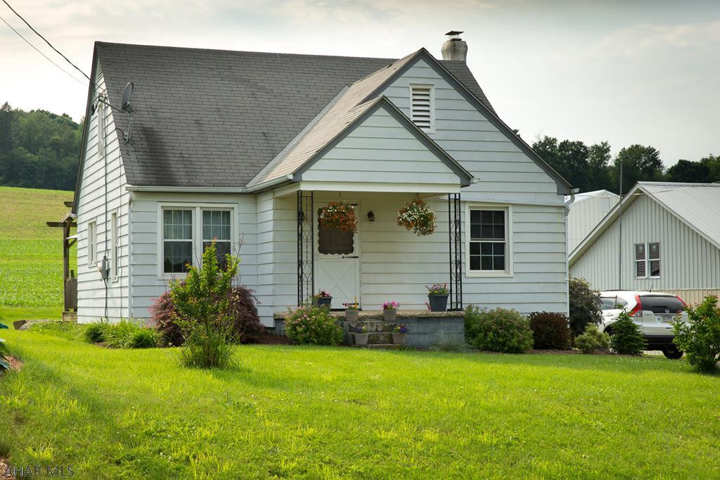 Cute country charmer in a great area! This is a quaint 3 bedroom home with a 2 car garage and a large lot. Enjoy privacy in this lovely country home. With many recent updates to this home, this house is waiting for you to call it home! Multiple sources of heat provide great options. Public sewer provides peace of mind and the private well saves you money. Spend those summer evenings enjoying the outdoors with the stamped concrete patio, Trex deck, and a lovely pergola. Privacy, storage, convenience, and low taxes! Call the listing agent for your private tour today!  Motivated sellers!