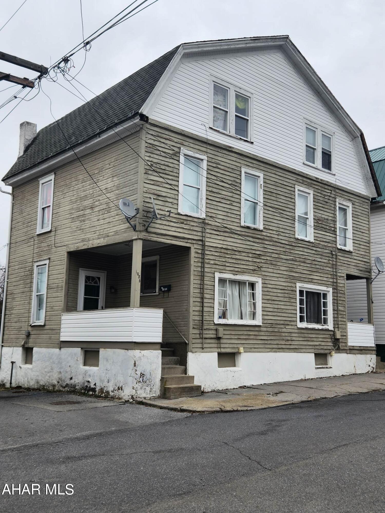 Two-unit duplex one side rented $450/month. Tenant paying $450/month pays all utilities.  This property is a 2 - 2 bedrooms units. There is a room that could be finished in the attic for a 3 bedroom. Natural gas, electric,  water, and sewer are separate with laundry in the basement.  The renter's certificate is current. The exterior will either need to be painted or sided per the city. The property is being sold in As-is condition. Call listing agent for more information.