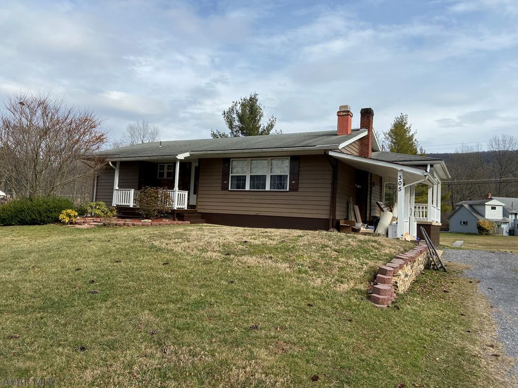 This well constructed 3 bedroom, 1 bath rancher with updated kitchen on .46 acres includes an additional lot to the right of it which also contains .46 acre.  Enjoy the evenings on either of the covered porches watching the natural wildlife.  And the wood burning fireplace in the large living room is great for those cool country evenings.  Original hardwood flooring is under all carpeted areas.  This quaint home has tons of storage in basement and attic.