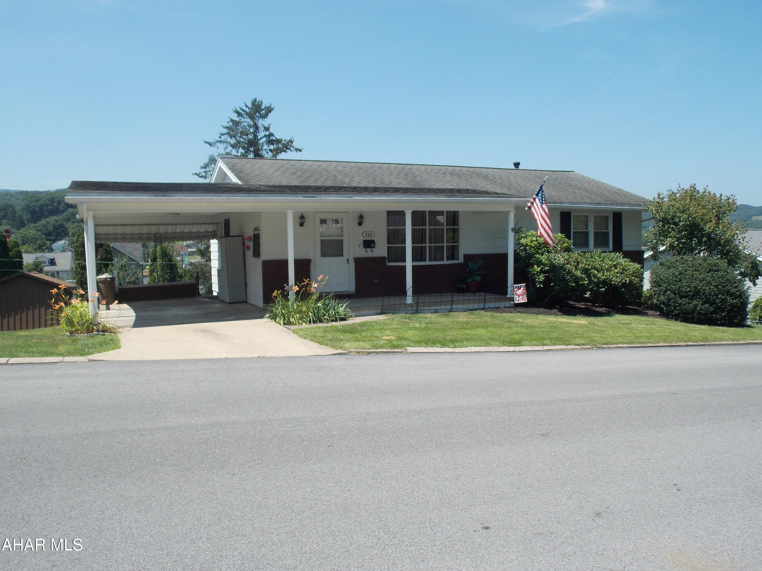 Easy living on one floor with this home on a 68 x 120 lot with a view of the mountains. The main floor has 2 bedrooms and an updated bath.  There is also a W/D combo unit on the main floor so no need to carry laundry downstairs. The updated eat in kitchen is bright and cheery and has a door from the carport for ease of unloading the car on grocery day.  The 2 bedrooms have HDWD floors which leads us to believe there may be HDWD under the carpet in the living room as well. The bath on the first floor and the one in the basement have been beautifully updated.
Down stairs is great for entertaining or could be an in-law suite or a rental.  There is space for a bedroom that fits a queen size bed and also a living room area and  a kitchenette area.  Down the hall you will find a beautiful new bath with W/D hookups. To keep the basement cozy and warm all winter there are 3 ceramic wall heaters.
Come spring the new owners with love that the basement walks out to a covered patio with a great view and a comfortable place to relax. The large back  yard is a great place to play or have a nice garden or a pool. 
This home also has lots of storage in the pull down attic and 2 storage rooms in the basement.
This one will not last long so call hurry and call for a showing!